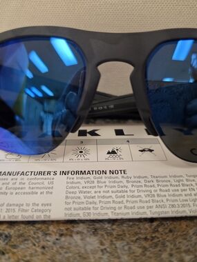 Oakley Matte Black Frame Sunglasses with Blue Mirrored Lenses